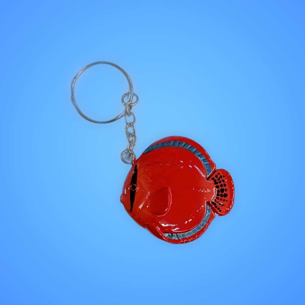 Colourful fish keychain with Aquarium Haven logo.