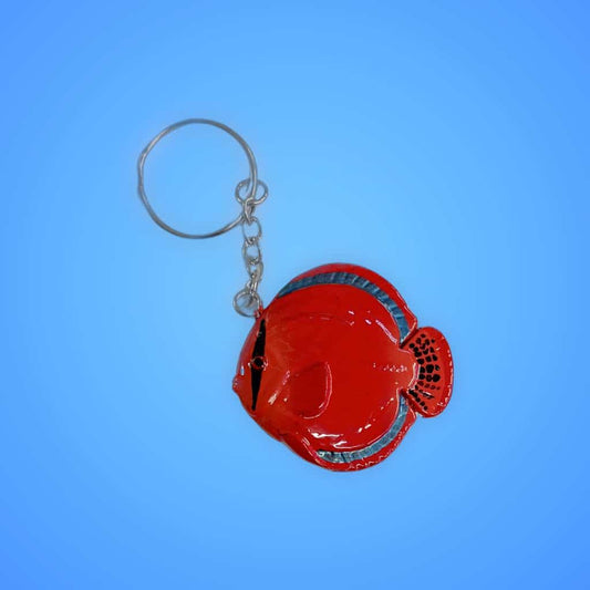 Colourful fish keychain with Aquarium Haven logo.