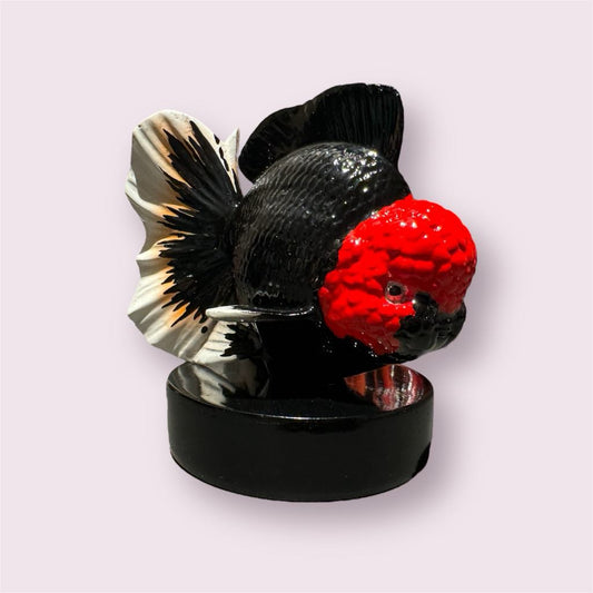 Hand-painted ceramic fish souvenir.