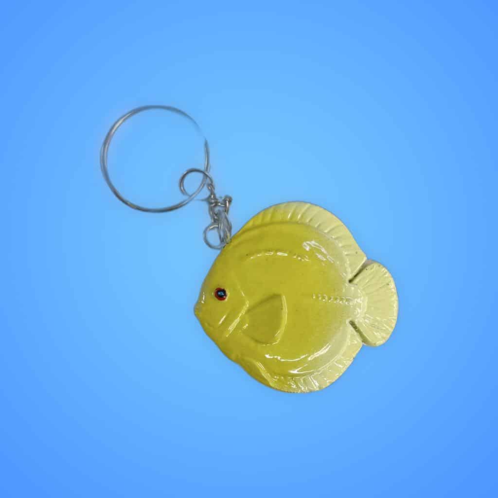 Blue enamel fish keychain souvenir item.